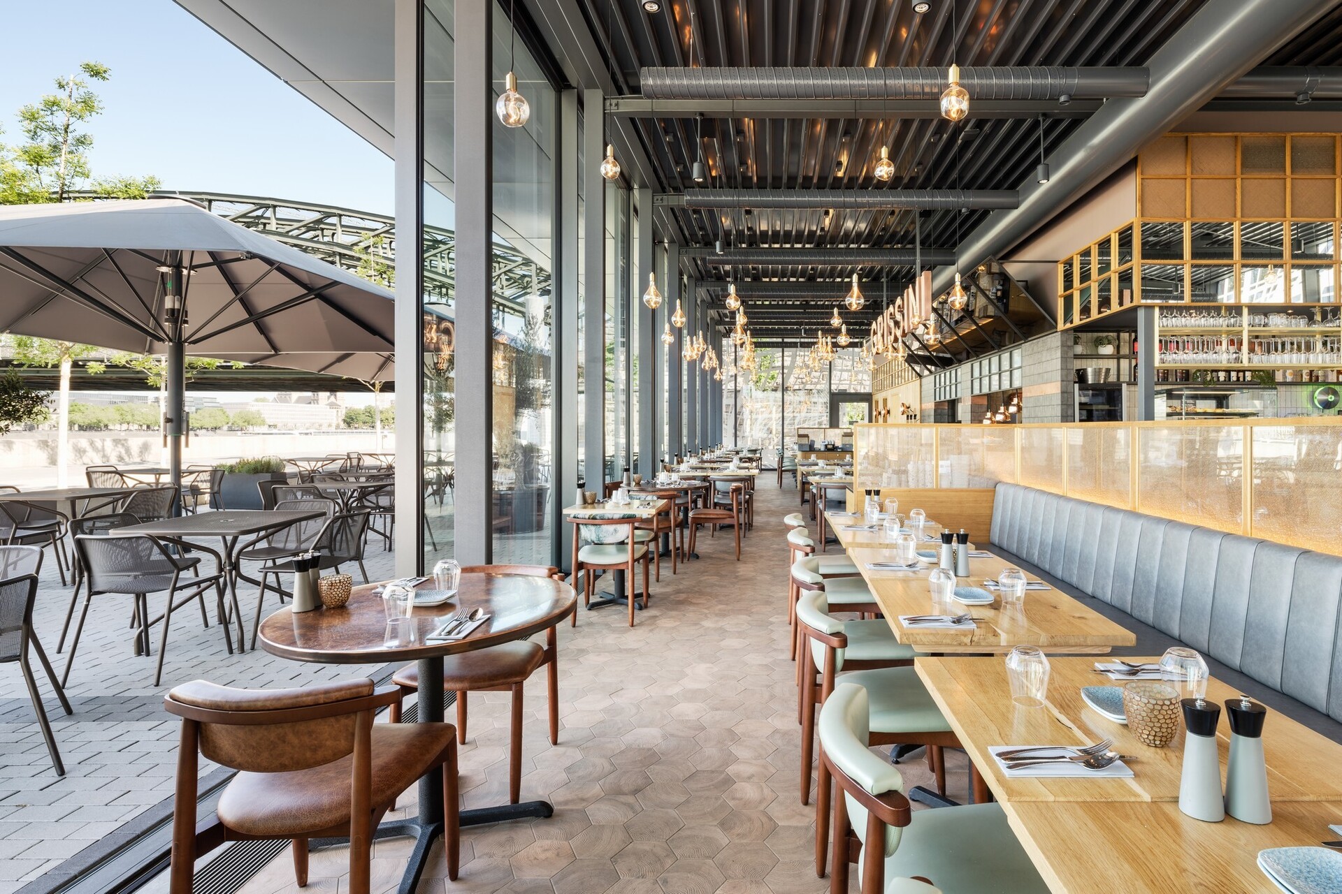 Restaurant design and fitout in Sydney by Petra Group, featuring a fitted-out dining room, bar and open kitchen