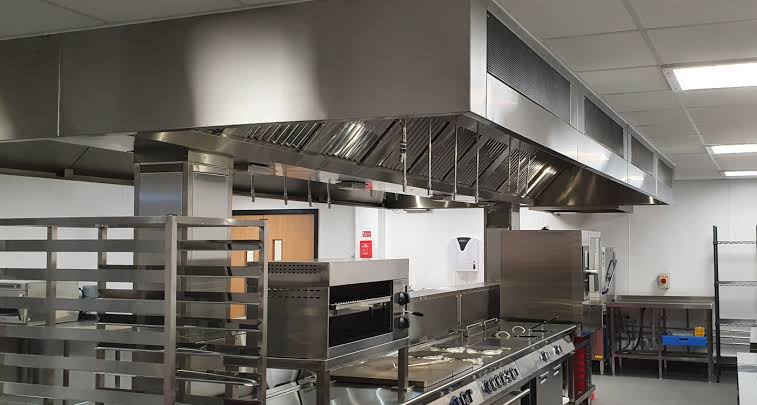 School kitchen shopfitting in Sydney with stainless steel benches, servery and commercial cooking line